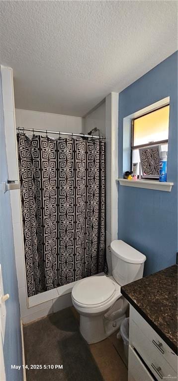 1009 W Champion St, Edinburg, TX 78539 - bathroom with a textured ceiling, toilet, a shower with curtain, and vanity