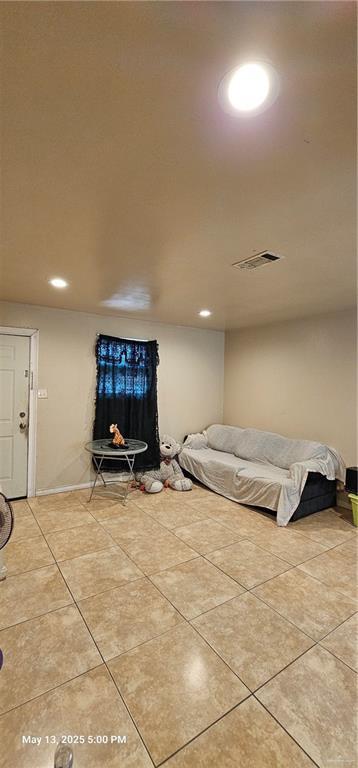 1009 W Champion St, Edinburg, TX 78539 - bedroom featuring light tile patterned floors, recessed lighting, and baseboards