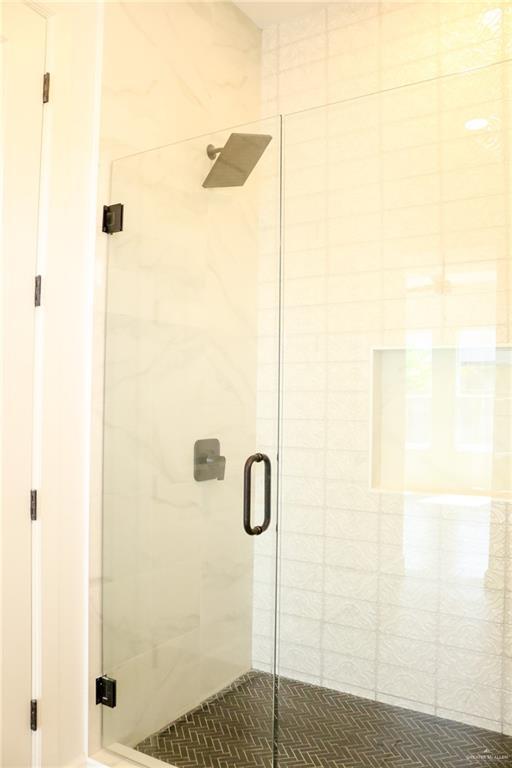 1904 Trophy Dr, Edinburg, TX 78542 - bathroom with a shower stall and tile patterned floors