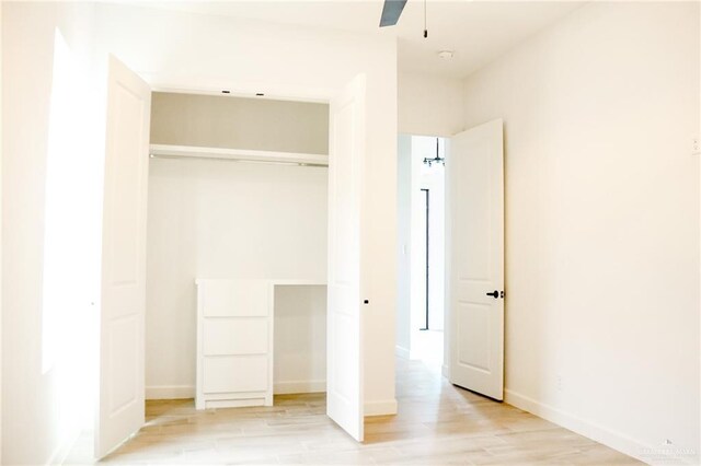 1904 Trophy Dr, Edinburg, TX 78542 - unfurnished bedroom featuring light wood finished floors, a closet, and baseboards