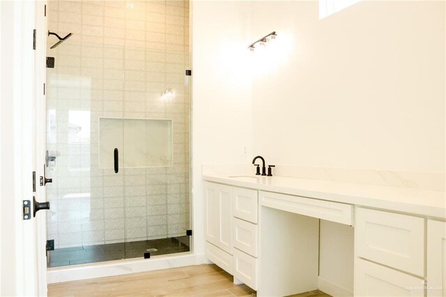 1904 Trophy Dr, Edinburg, TX 78542 - full bathroom with a shower stall, vanity, and wood finished floors