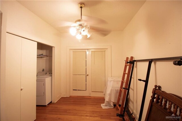 11009 Monte Cristo Rd, Edcouch, TX 78538 - corridor with washer / clothes dryer and light wood finished floors