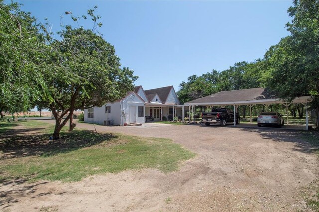 11009 Monte Cristo Rd, Edcouch, TX 78538 - exterior space with a detached carport and dirt driveway