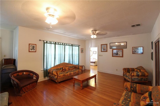 11009 Monte Cristo Rd, Edcouch, TX 78538 - living area with ceiling fan, wood finished floors, and a textured ceiling