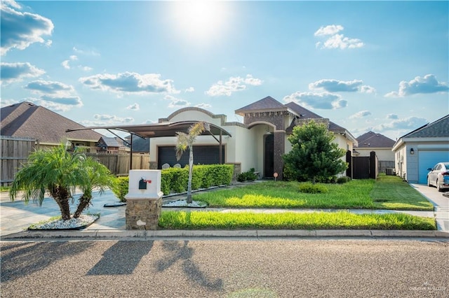 view of front of house featuring a carport, a garage, and a front lawn