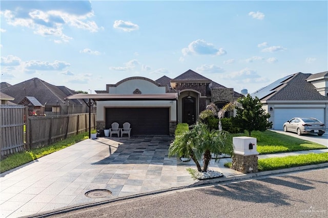 view of front of property featuring a garage and a front lawn