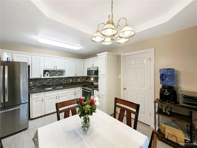 1003 Thornwood Dr, Mission, TX 78574 - dining room with a chandelier