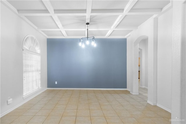 tiled empty room featuring beamed ceiling and coffered ceiling