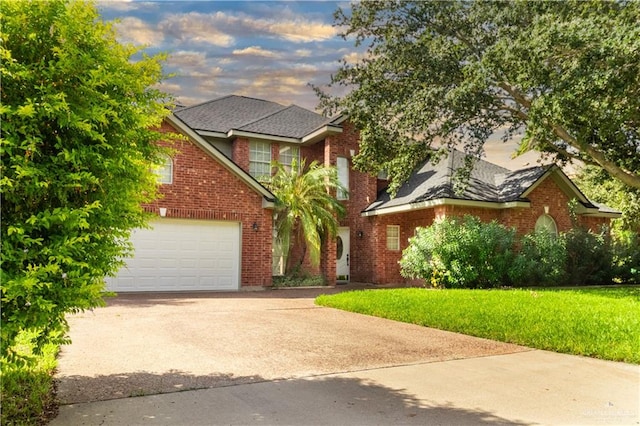 view of front of house featuring a garage and a lawn