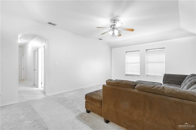 living room featuring light colored carpet and ceiling fan