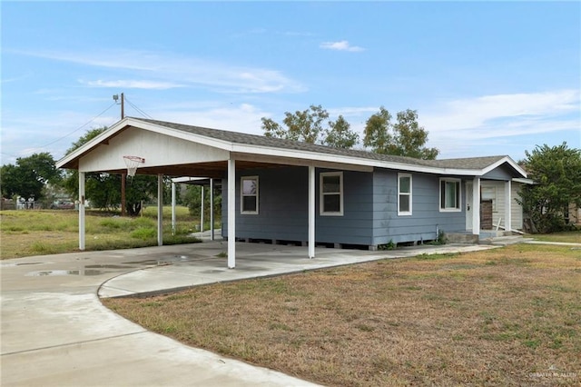 ranch-style home with a carport and a front yard