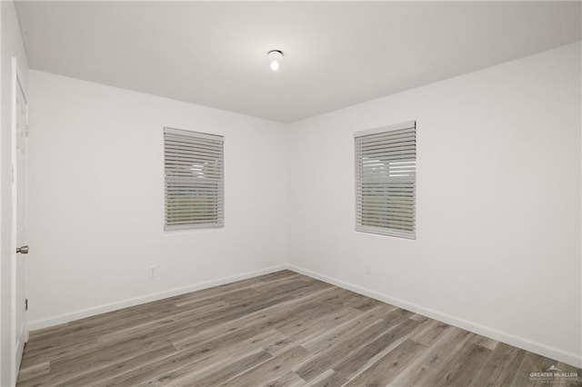 spare room featuring hardwood / wood-style flooring