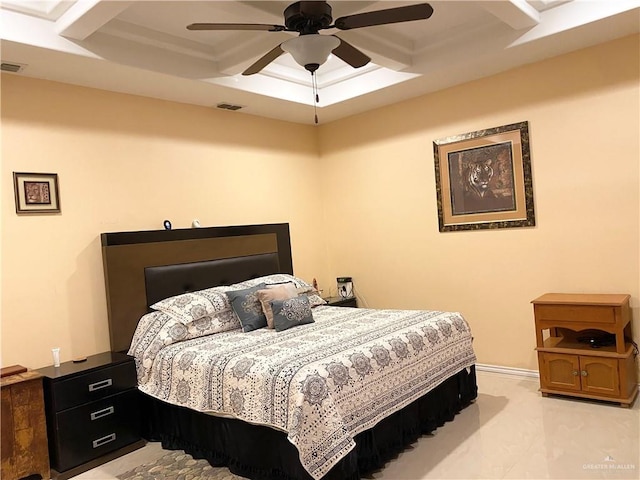 bedroom featuring a raised ceiling and ceiling fan