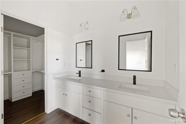 bathroom featuring hardwood / wood-style flooring and vanity