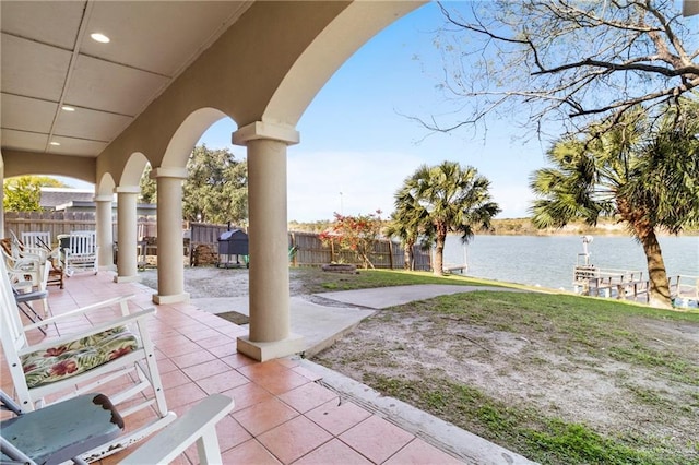 view of patio with a water view