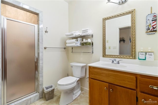 bathroom with vanity, toilet, walk in shower, and tile patterned flooring