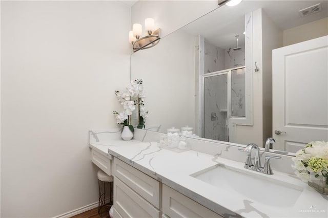 bathroom with vanity and walk in shower