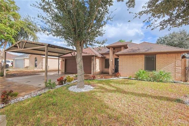 view of front of property featuring a front lawn, a carport, and a garage