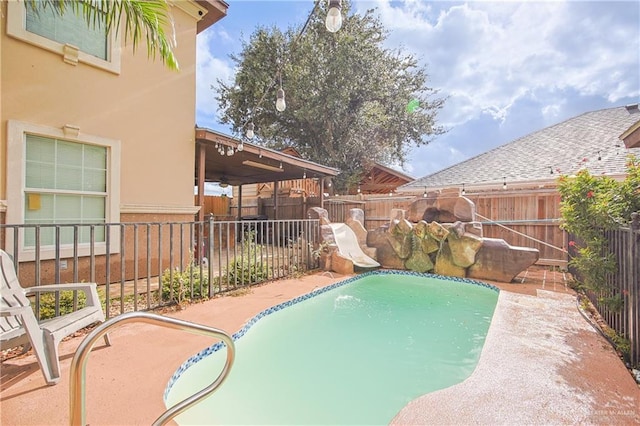 view of pool featuring a water slide