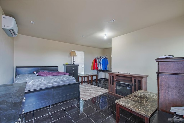 bedroom with an AC wall unit