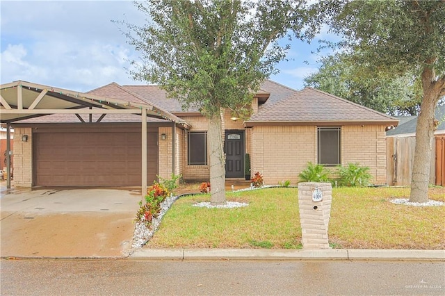 view of front facade with a garage and a front yard