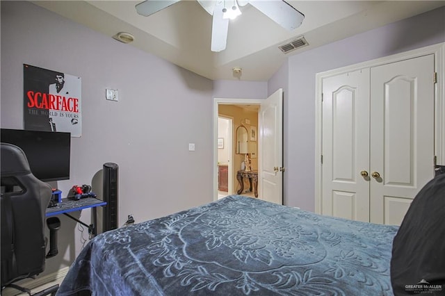 bedroom with ceiling fan and a closet