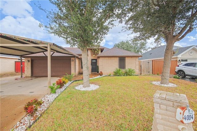 ranch-style house featuring a front lawn, a carport, and a garage