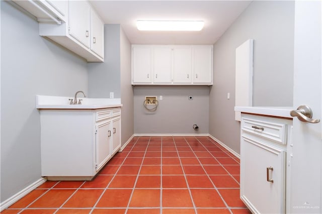 laundry room featuring tile patterned floors, hookup for a washing machine, cabinets, and hookup for an electric dryer