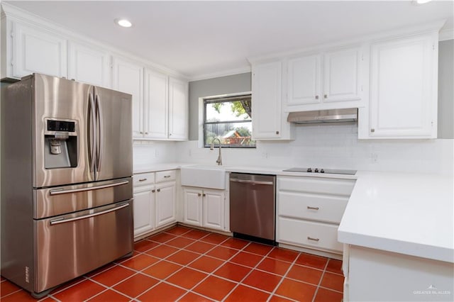 kitchen featuring decorative backsplash, stainless steel appliances, sink, white cabinetry, and range hood