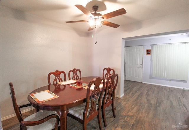 dining area with baseboards, wood finished floors, and a ceiling fan