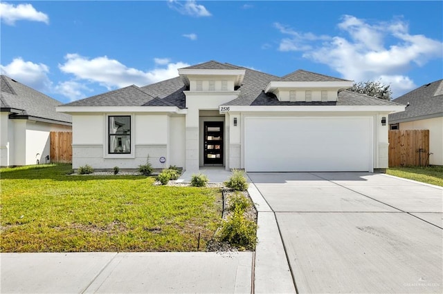 prairie-style house with a front yard and a garage