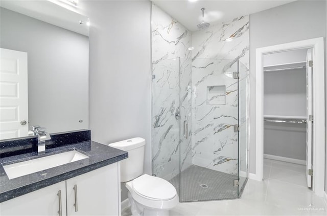 bathroom with tile patterned flooring, vanity, toilet, and an enclosed shower