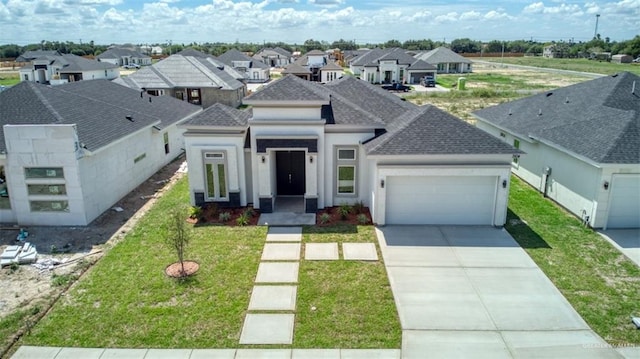 view of front of house with a front lawn and a garage