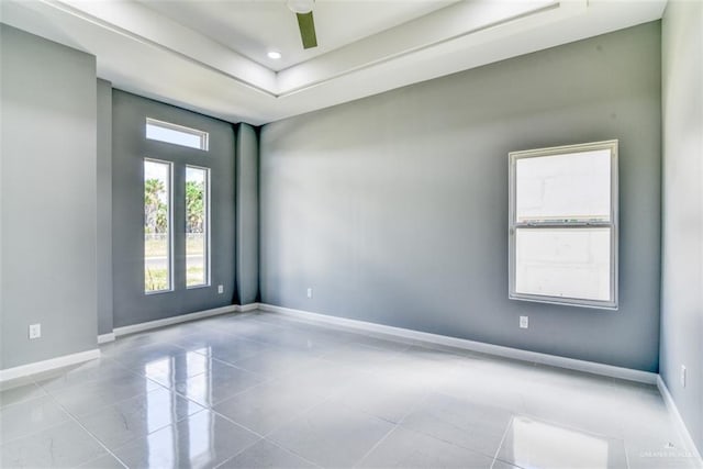 unfurnished room featuring light tile patterned floors and ceiling fan