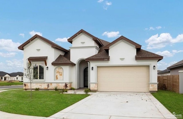 2080 Eagle Landing Dr, Edinburg, TX 78542 - view of front of house with roof with shingles, stucco siding, a garage, and driveway