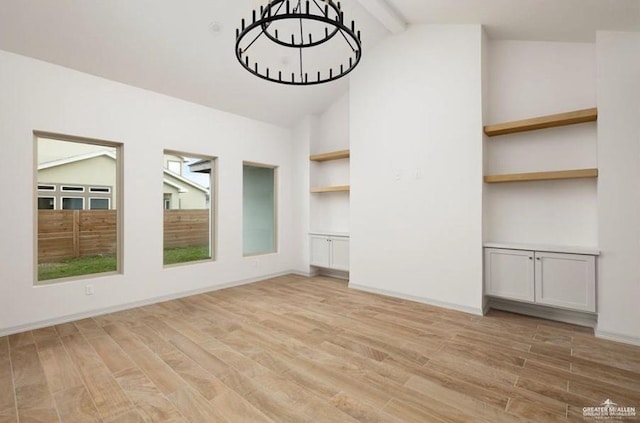 2080 Eagle Landing Dr, Edinburg, TX 78542 - spare room with light wood finished floors and a chandelier