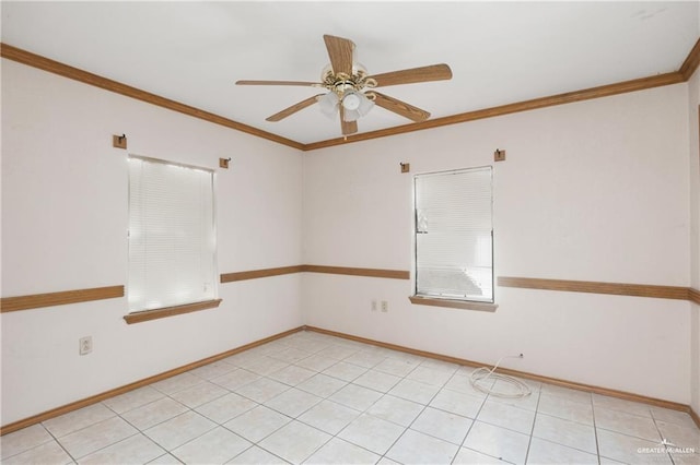 spare room with ceiling fan and ornamental molding