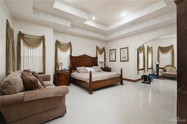 bedroom with baseboards, recessed lighting, light tile patterned floors, and a raised ceiling