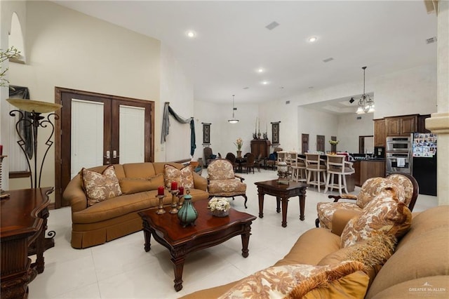 living area with recessed lighting and light tile patterned floors