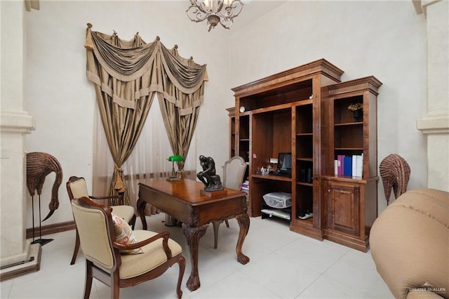 office area featuring baseboards and a chandelier