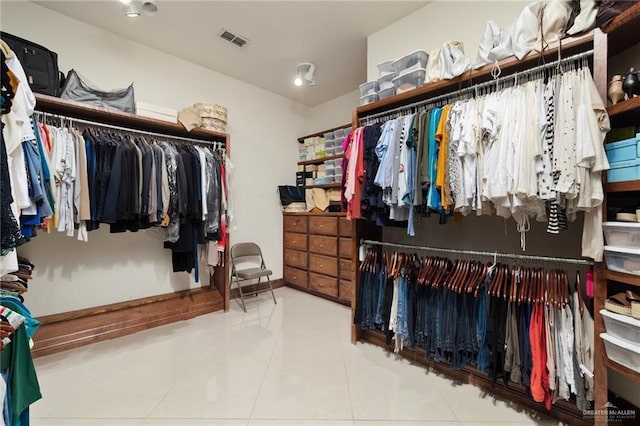 walk in closet featuring tile patterned flooring and visible vents