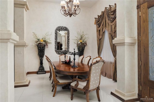 dining room with light tile patterned floors, baseboards, and a chandelier