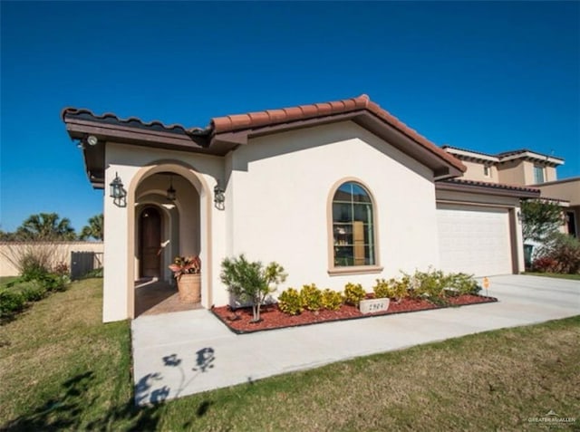 mediterranean / spanish-style house with a front lawn and a garage