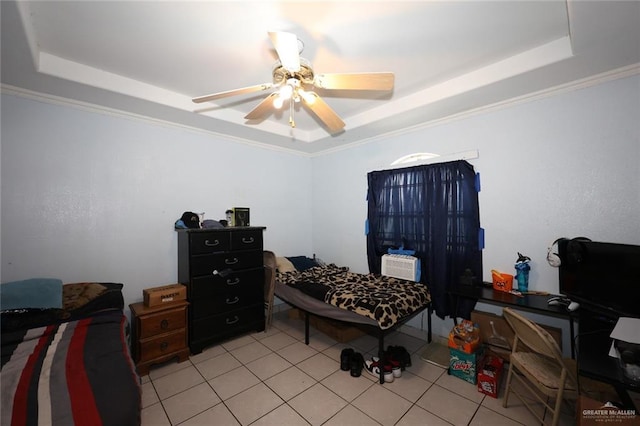 bedroom featuring a raised ceiling, ceiling fan, and crown molding