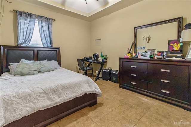 bedroom with light tile patterned floors