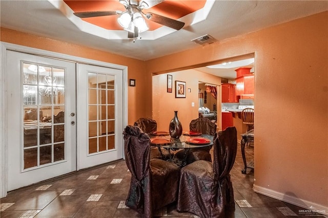 dining area with french doors and ceiling fan