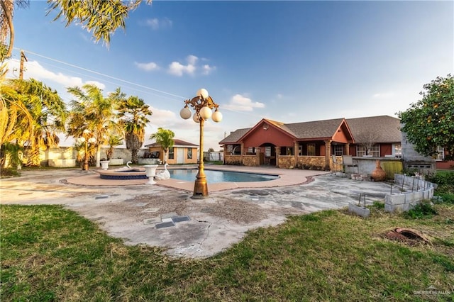 view of swimming pool with a yard and a patio area