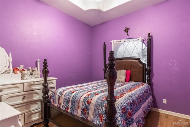 bedroom with wood-type flooring