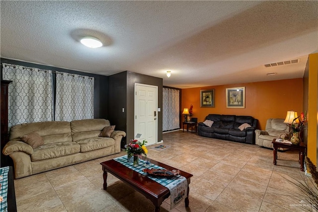 living room with a textured ceiling