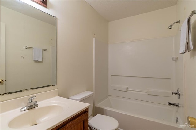 full bathroom featuring vanity, toilet, and bathtub / shower combination